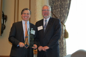 Steve Schulman (l) accepting the 2014 Outstanding Pro Bono Advocacy in MLP Award on behalf of Akin Gump from the American Bar Association's Steve Scudder (r).